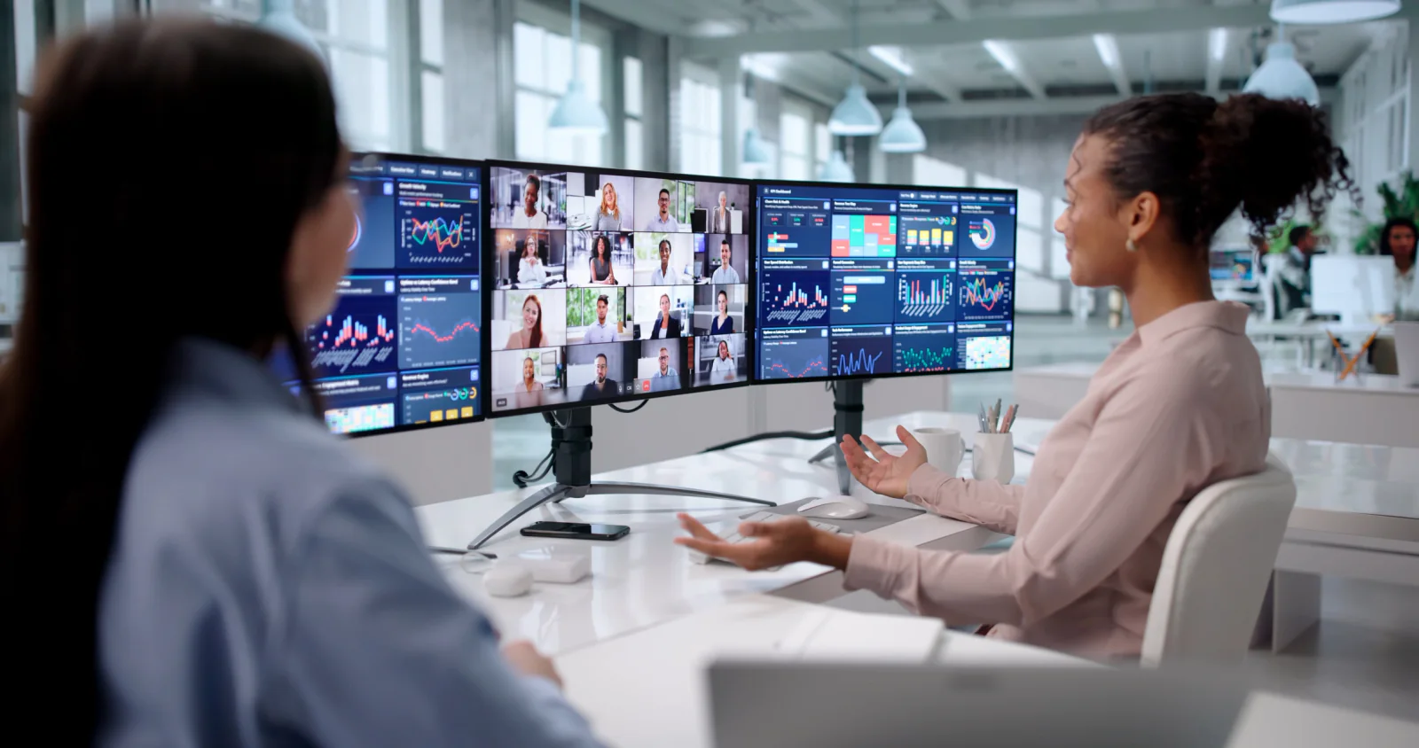 Conference session capture setup with recording laptop, monitors, presentation feed support, and content library production workflow
