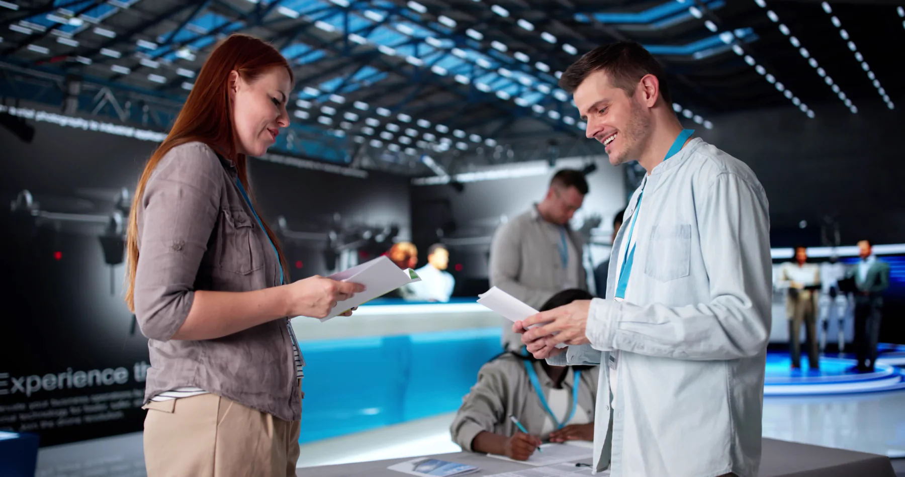 Event staff using iPads to check in attendees at registration counters and welcome desks