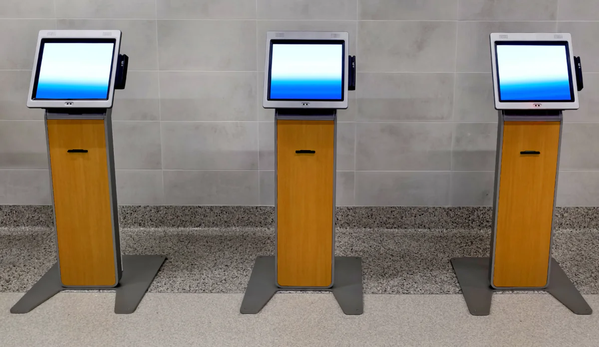 Tablet mounted in a floor stand kiosk used for event registration, self service check in, and information display
