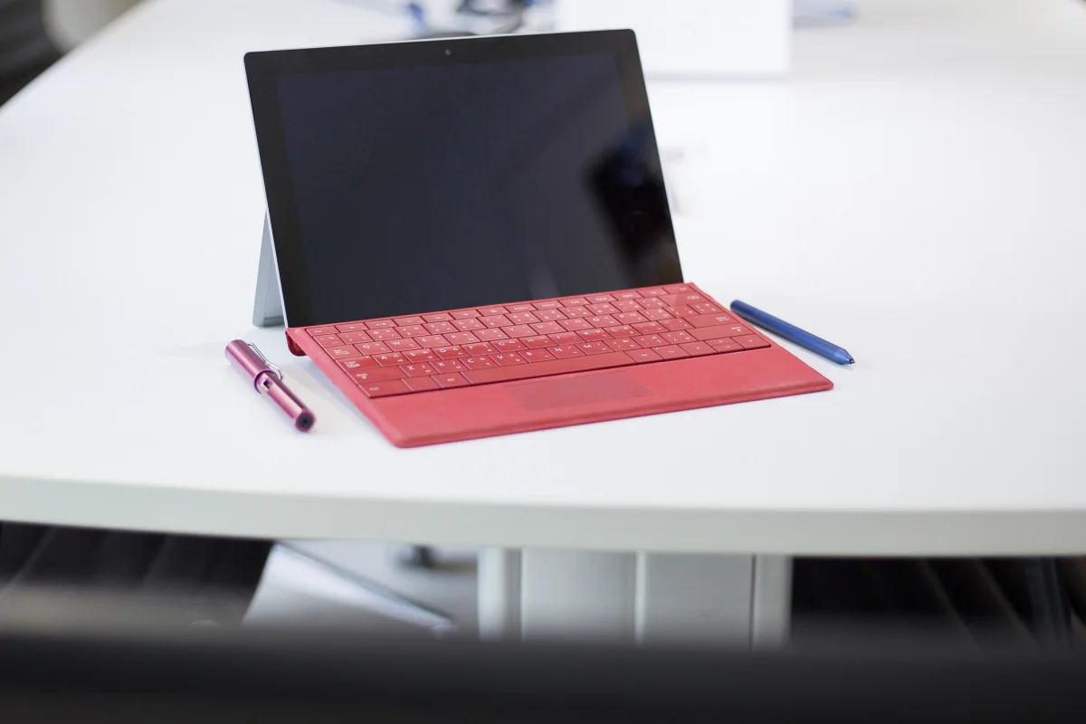 Microsoft Surface tablets prepared for hybrid work, shared desk environments, and flexible meeting room use