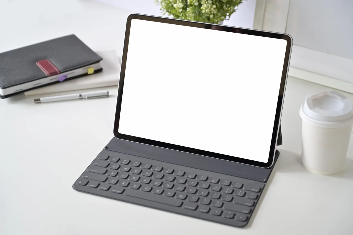 Person holding a small iPad Mini in one hand for mobile survey, POS, and line busting use