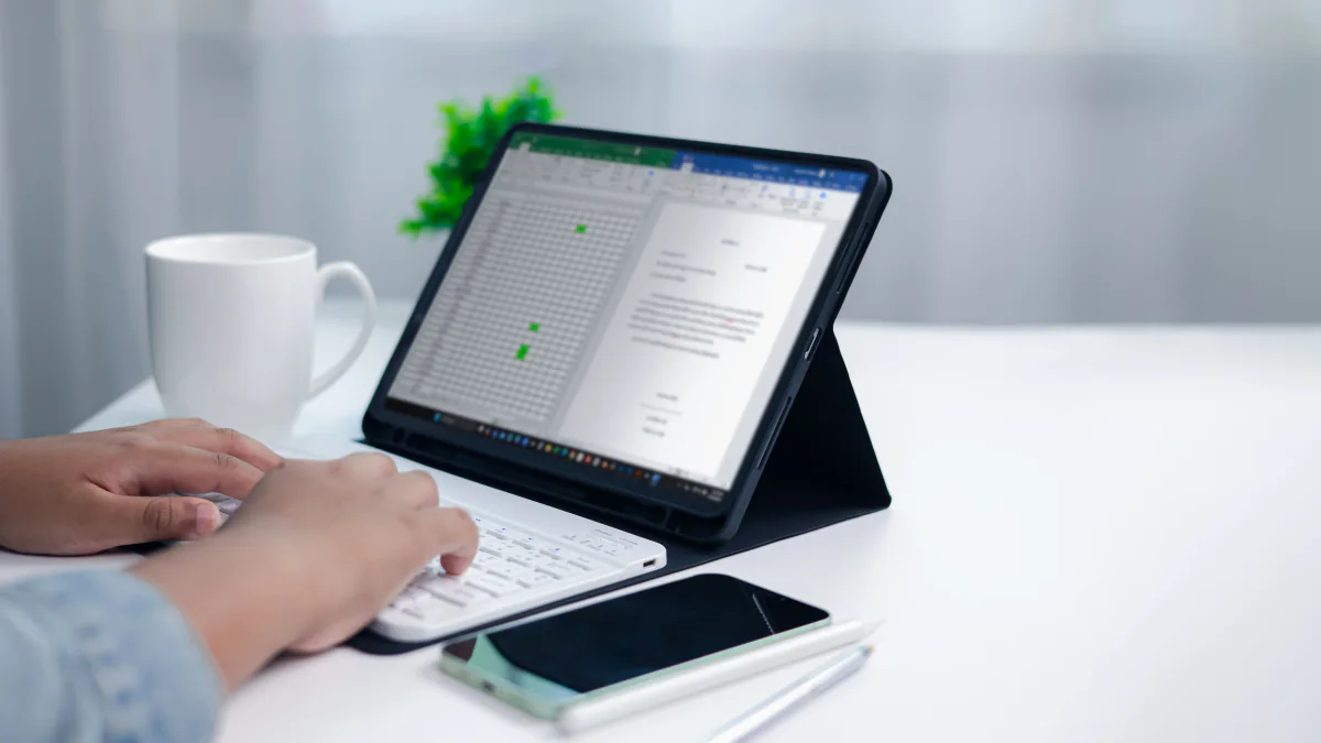 Surface Pro with keyboard and pen on a desk for hybrid work, note taking, and Windows business use