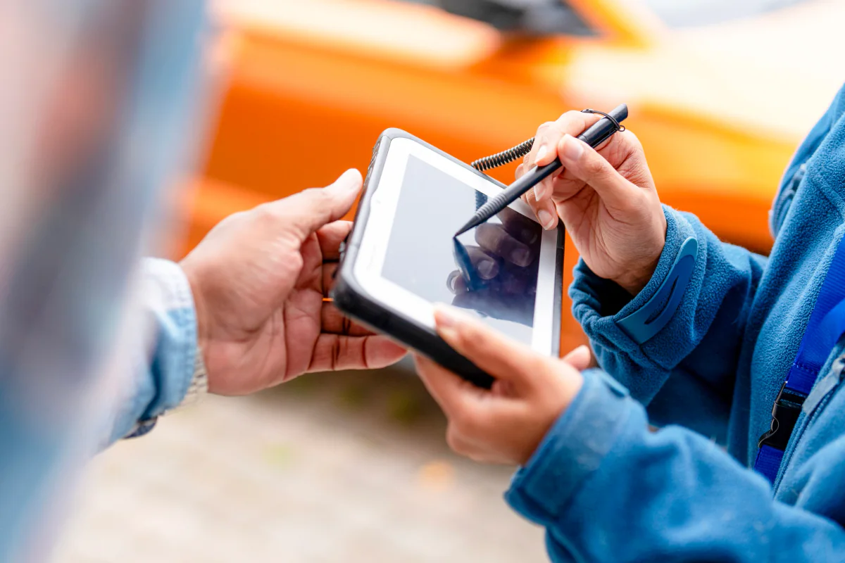Person using an Android tablet to capture survey and lead information at an event