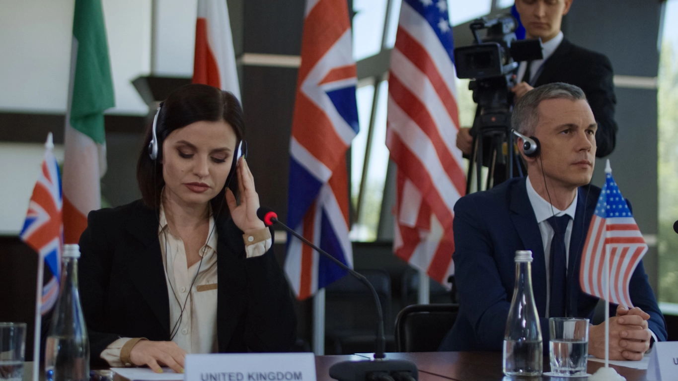 Conference attendees using wireless interpretation headsets during a multilingual business event