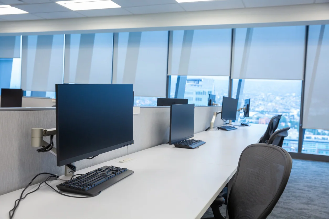 Temporary office with brand-aligned rental laptops, monitors, and workstations supporting project teams and overflow staff
