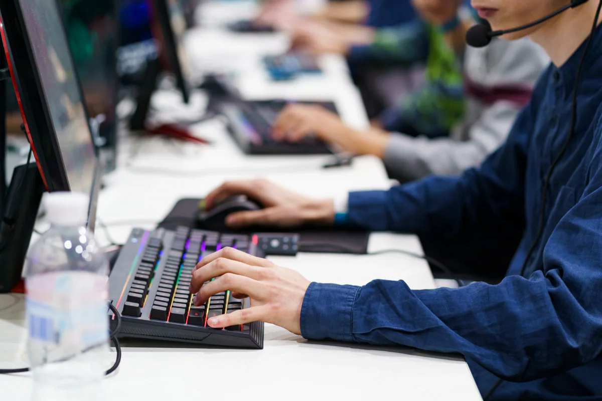 Portable gaming setup with gaming laptop, accessories, and compact event station designed for mobile or creator use
