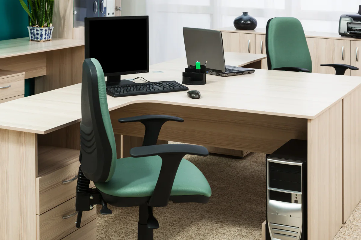 Technology rental planning desk with laptop tablet notes and budgeting materials for early quote scoping