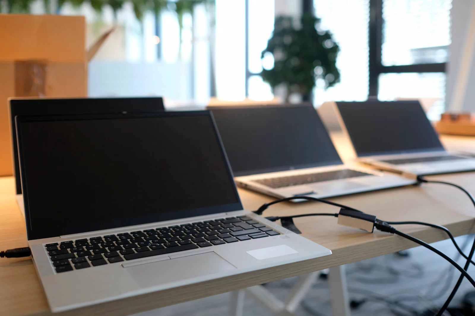Temporary office rental setup with computers printers monitors and networking used for project pricing and deployment planning