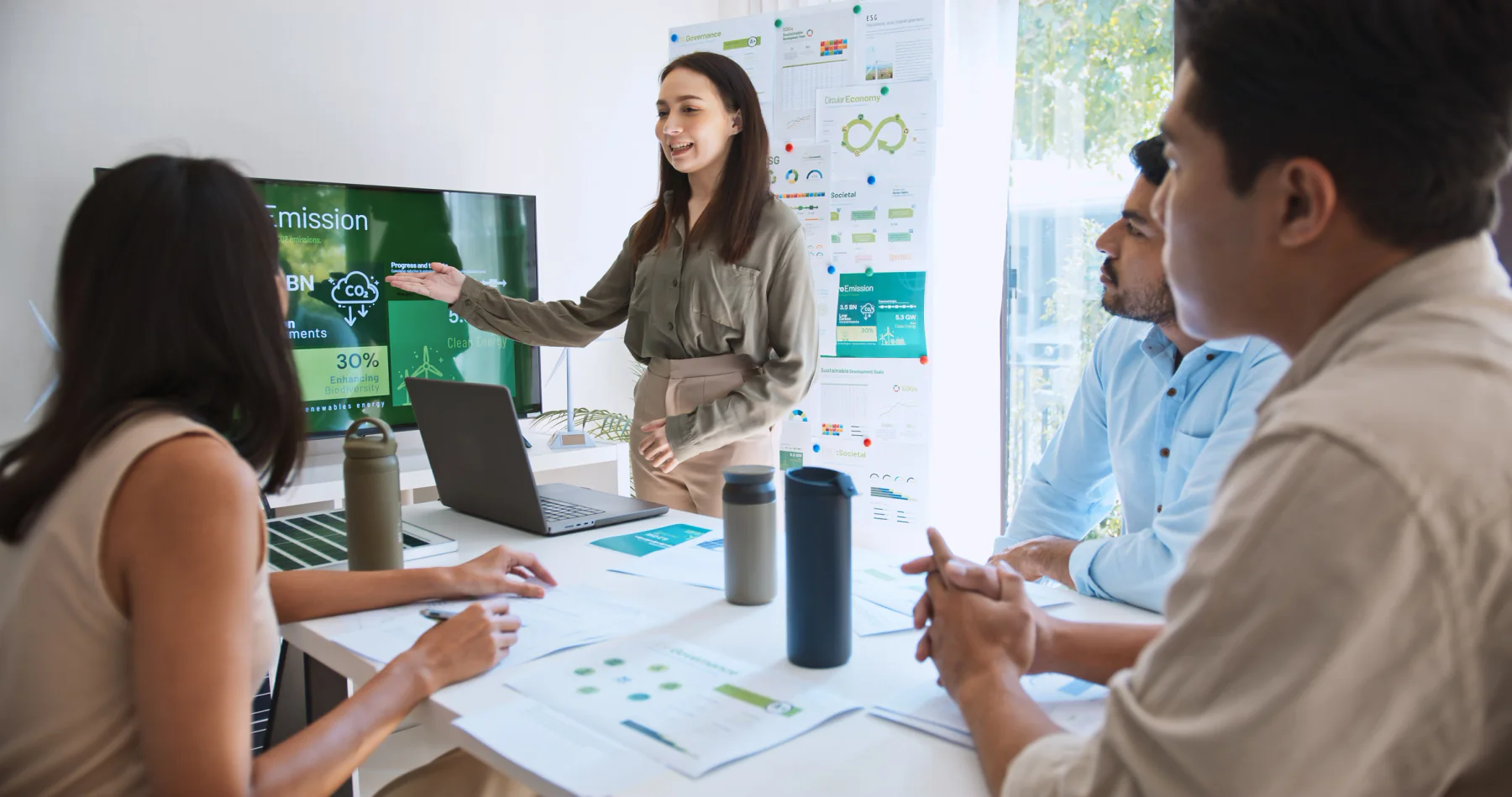 Presentation support setup with laptop, large display, adapters, and meeting room AV