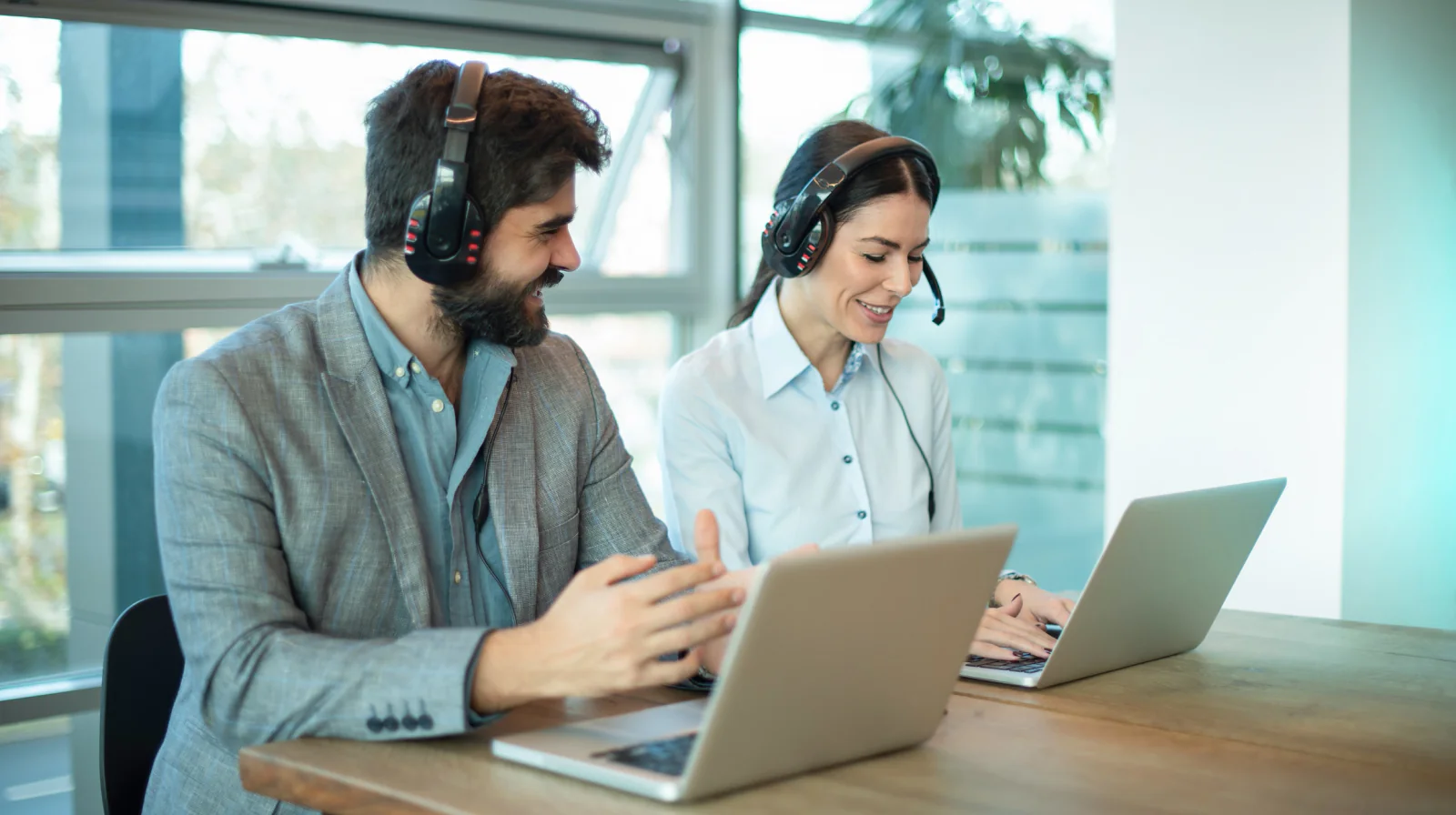 Distributed team collaborating across multiple remote locations using laptops, video meetings, and cloud communication software