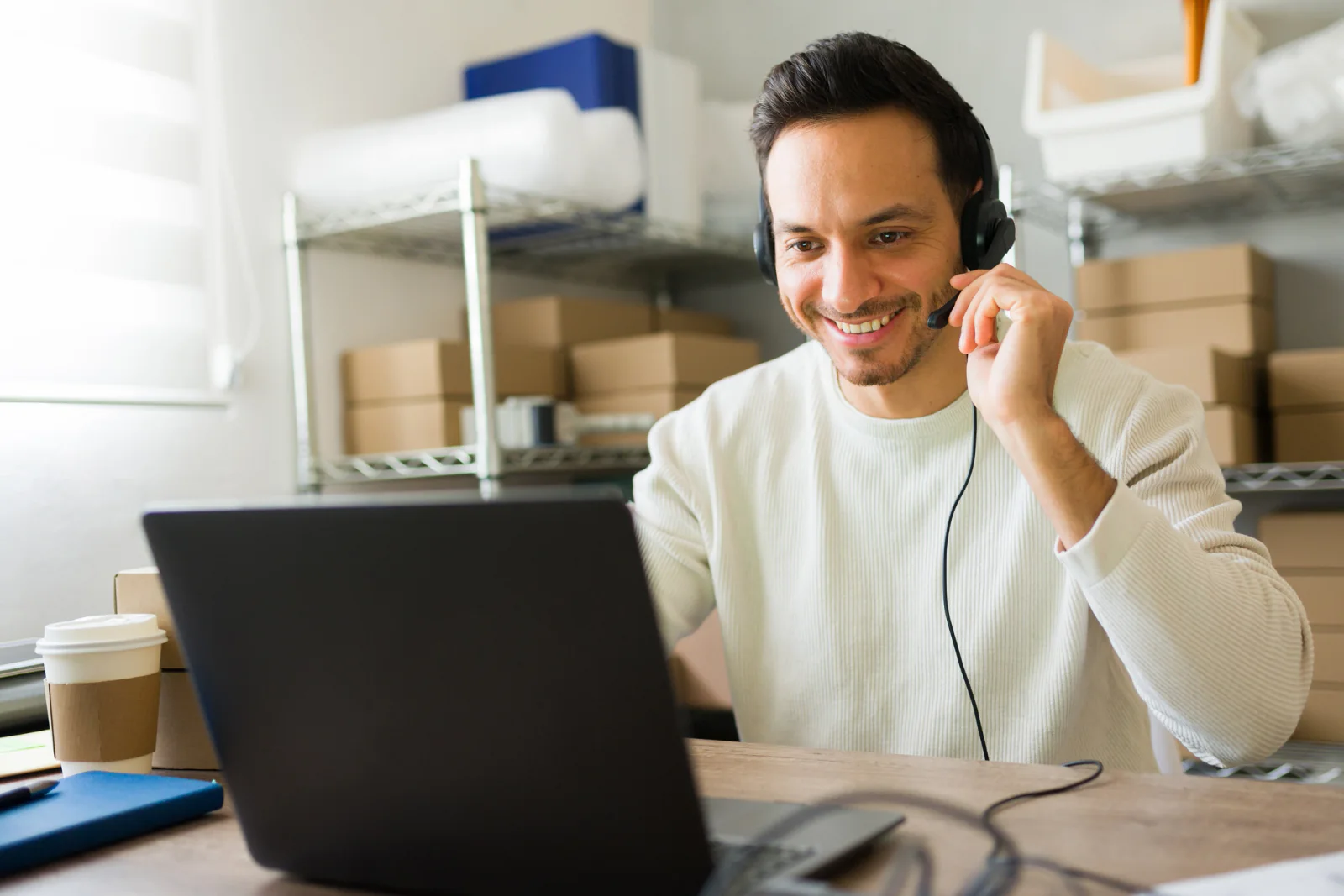 Remote youth program participant using standardized rental laptop and headset during a virtual camp or online enrichment session