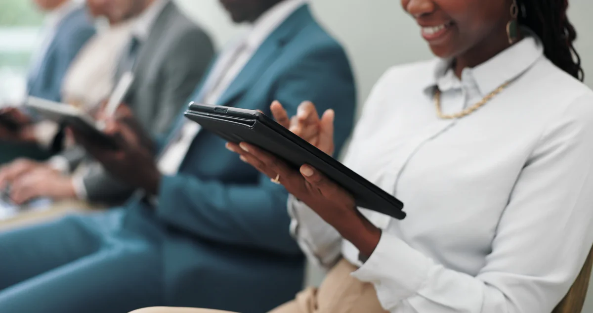 Training room with attendees using rental tablets for short term learning and temporary program deployment